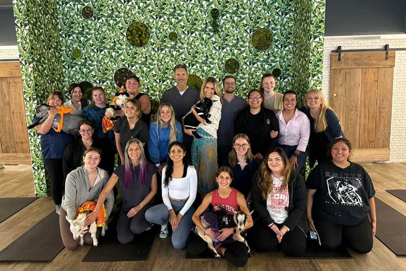 Group photo at goat yoga